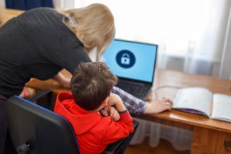 young boy at desk