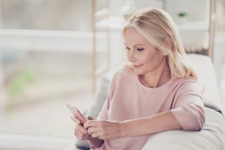 woman on phone on couch